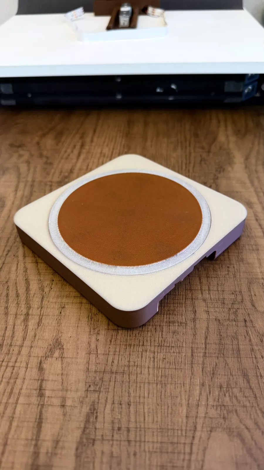 Multi-material printed base in cream and brown with a terracotta coaster