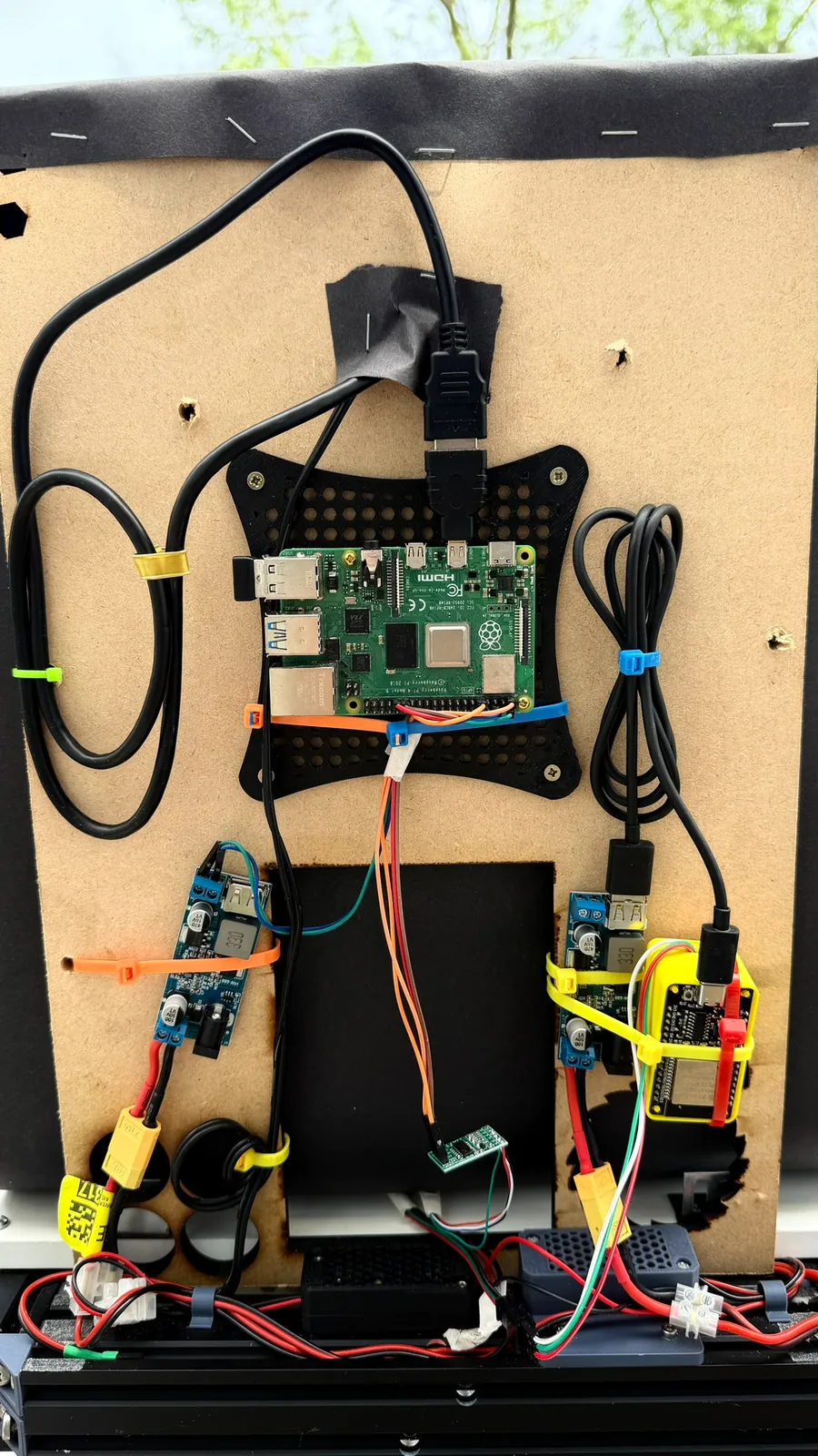 The electronics panel: Raspberry Pi, buck converters and wiring mounted on a plywood board