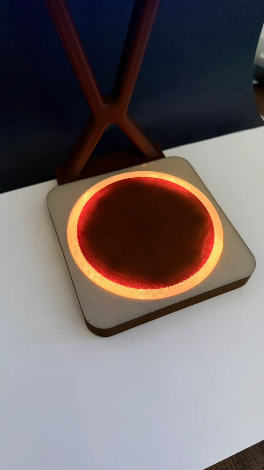 Close-up of the light ring glowing around the coaster