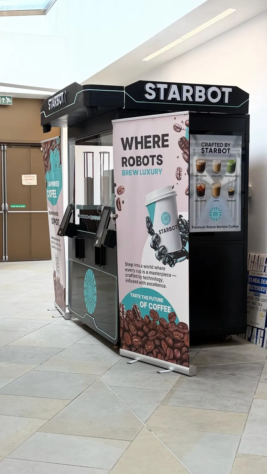 A robot coffee kiosk in a station concourse