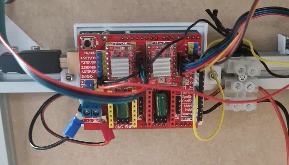 Photo of the real wiring: CNC shield on an Arduino with stepper and servo leads