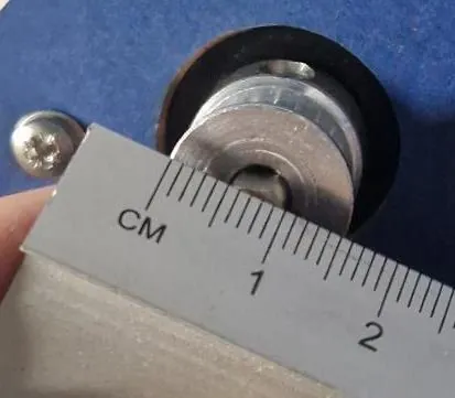 A ruler measuring the GT2 toothed pulley at 15 millimetres across